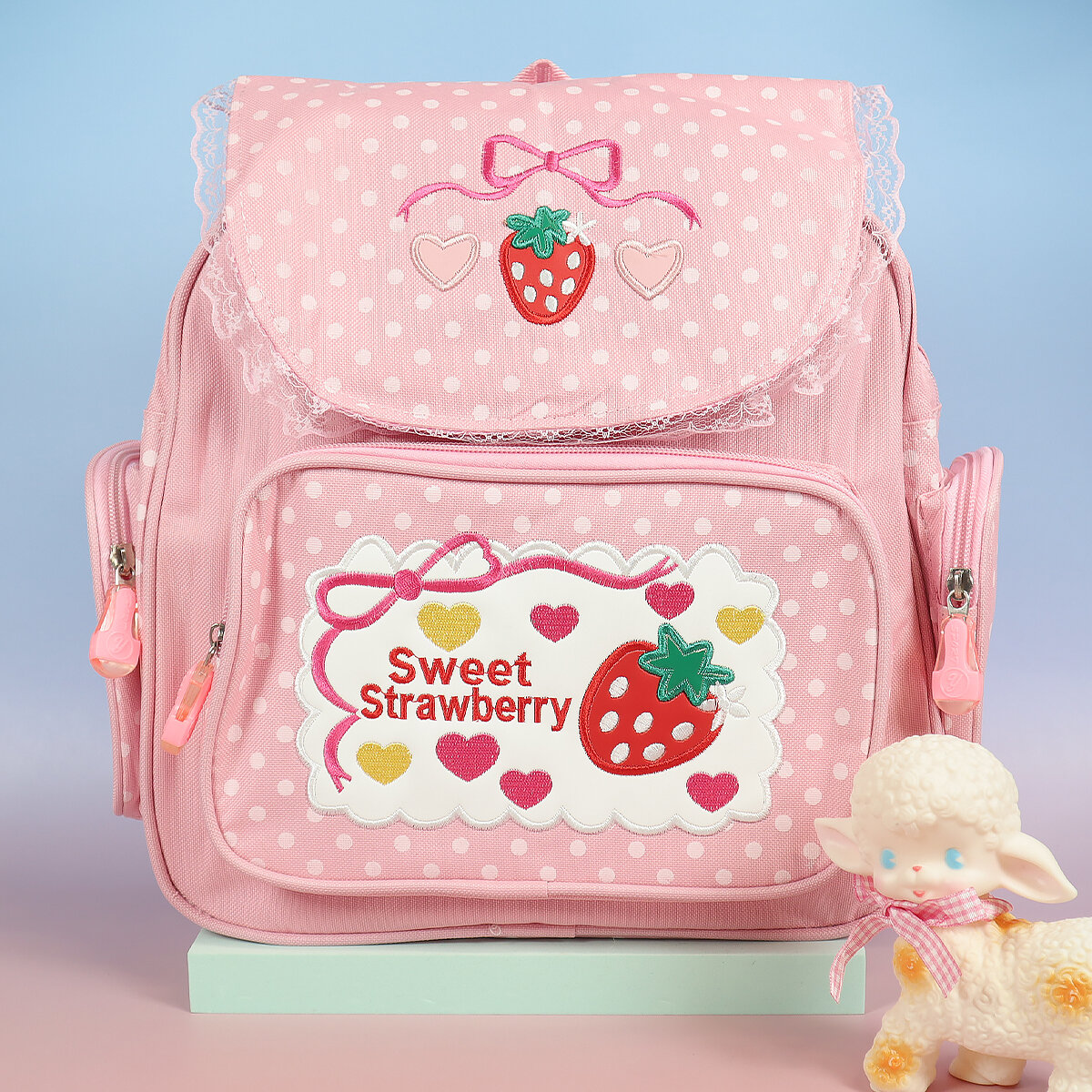 Rosa prickig ryggsäck jordgubbar