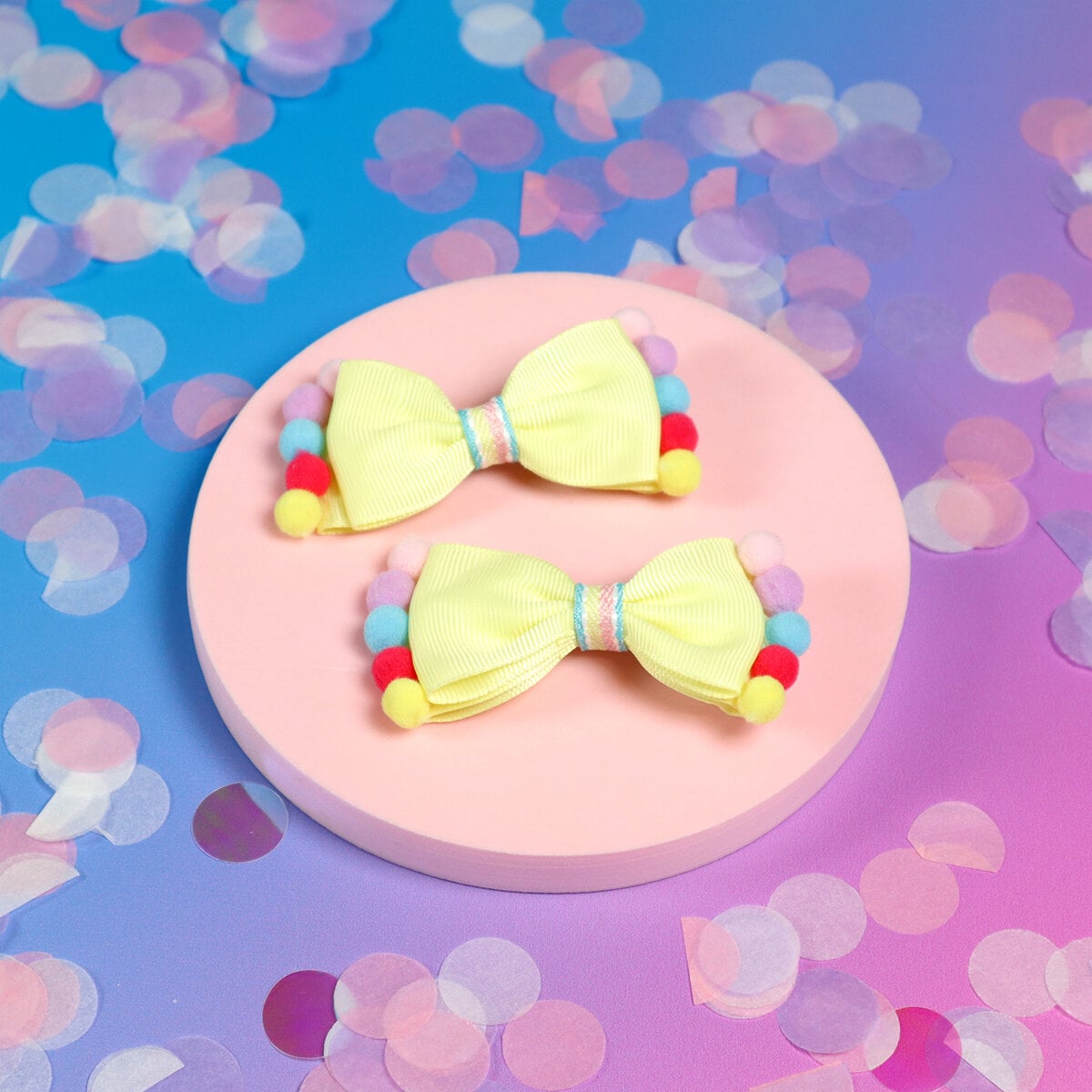 2-pack pastellgul rosett med pompoms