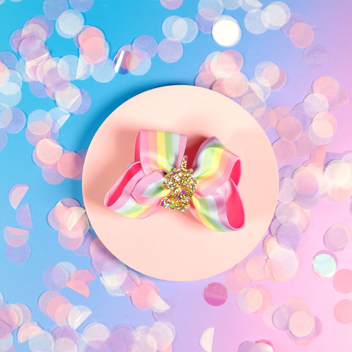 Regnbågsrosett med glittrig unicorn