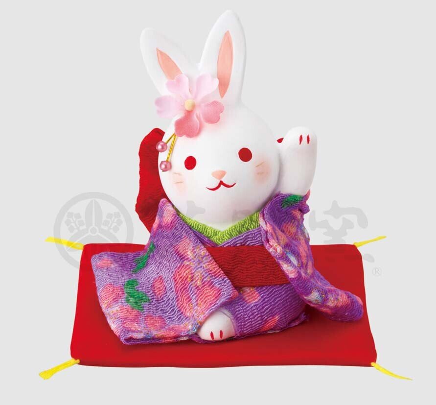 Vinkande kanin med lila kimono