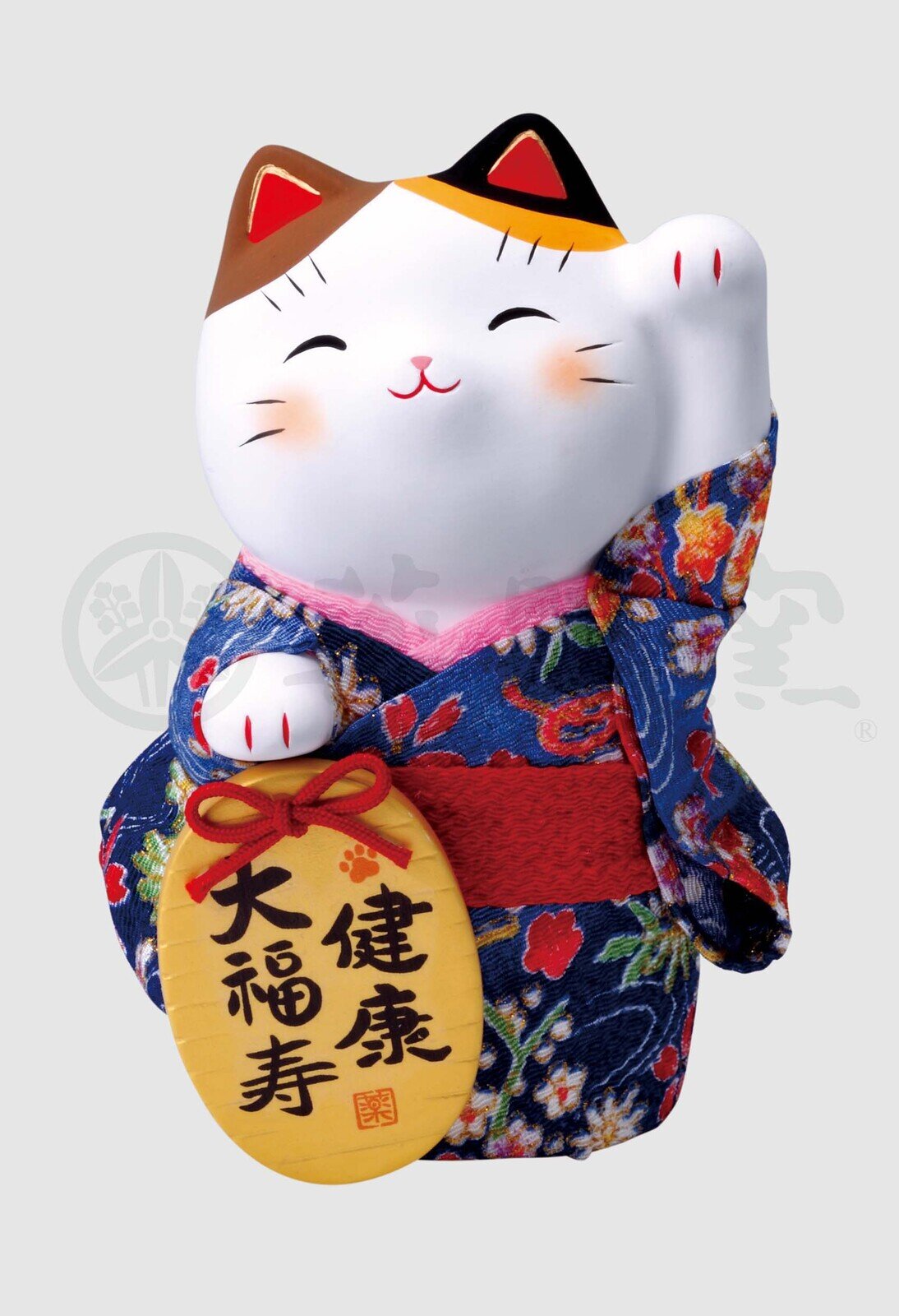 Vinkande calico-lyckokatt med blå kimono