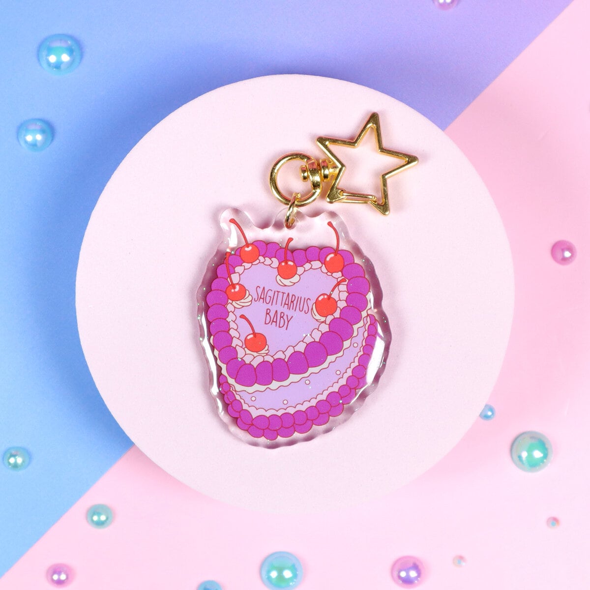 Glittrig bag charm - Sagittarius cake