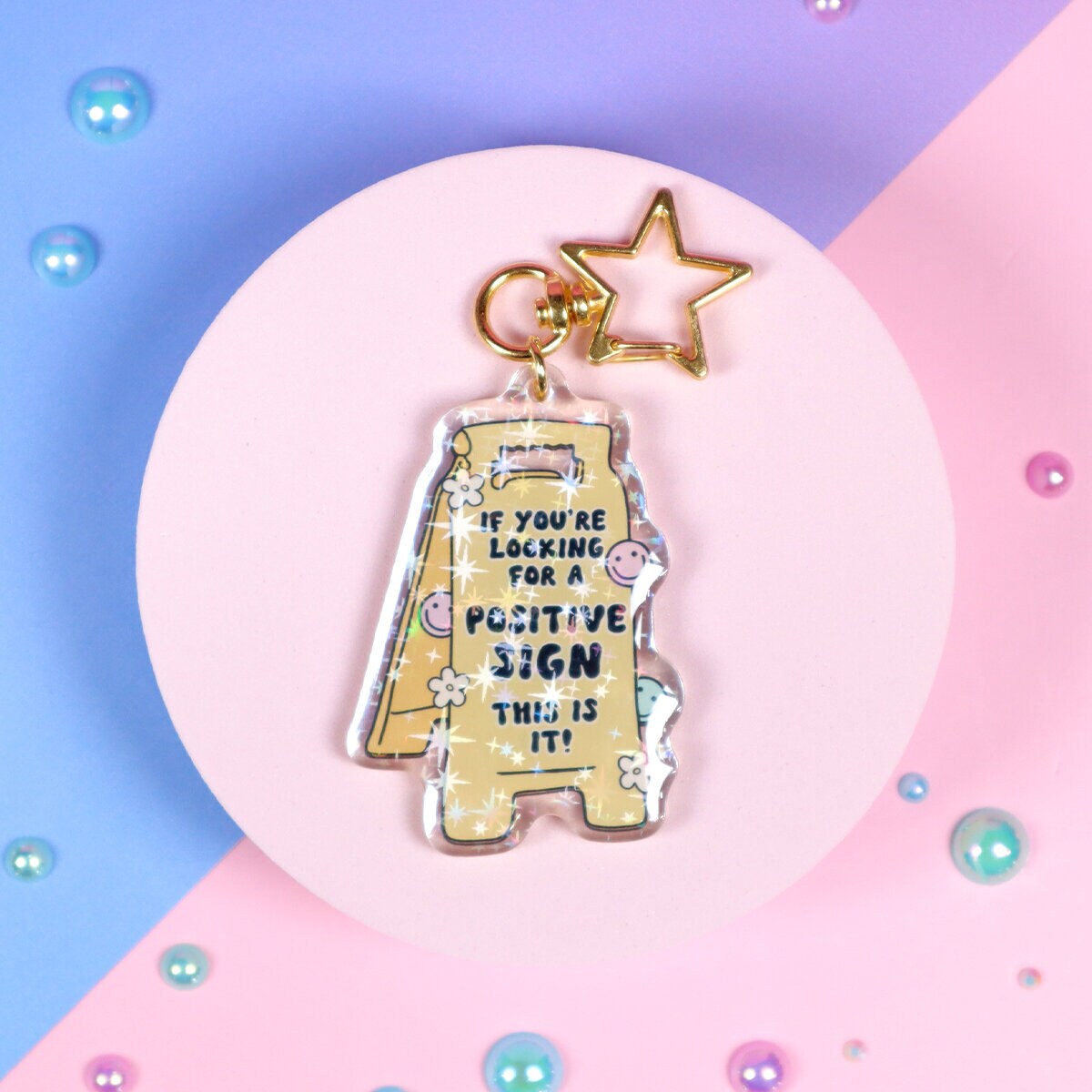 Glittrig bag charm - Positive sign