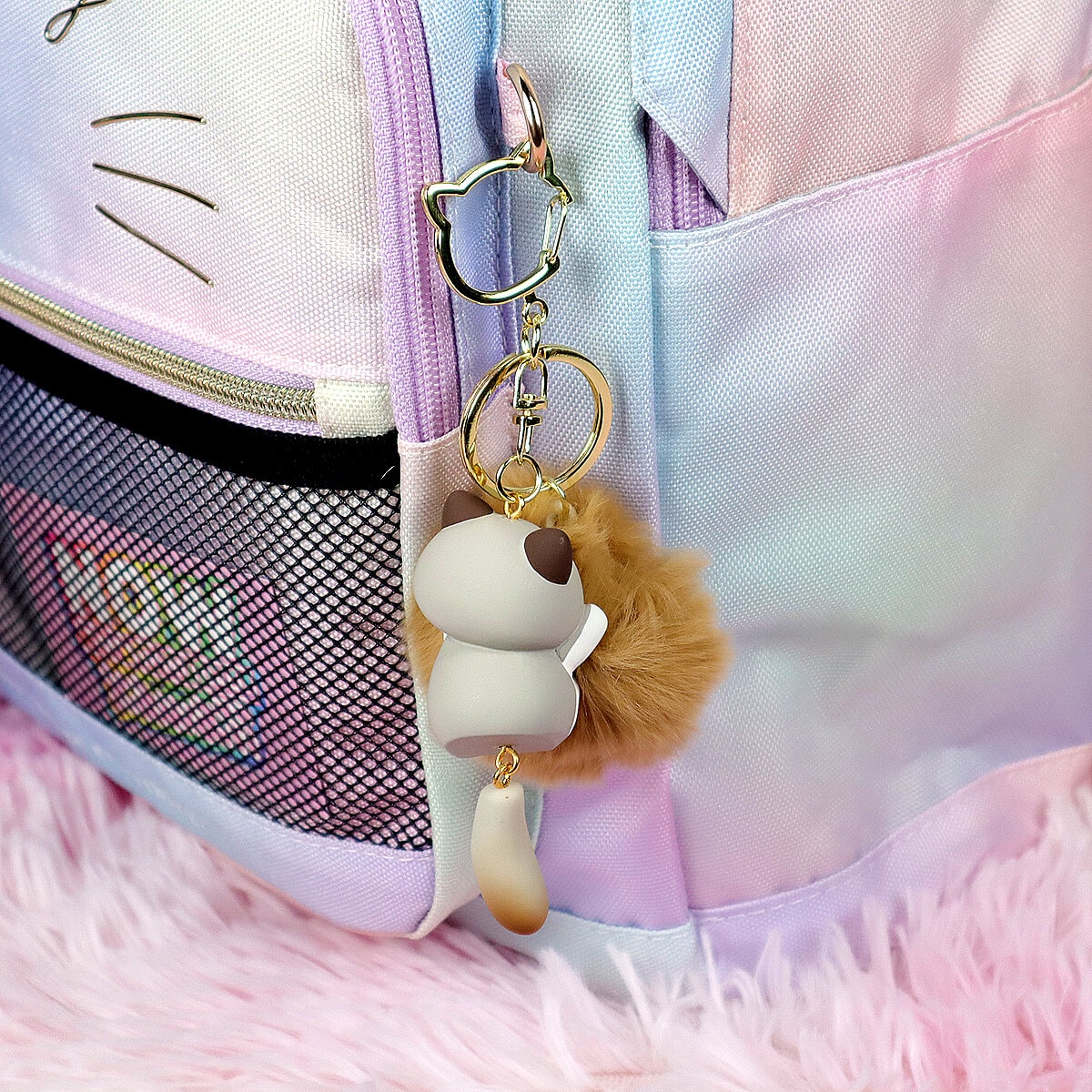 Puffig bag charm brun-vit katt med svans