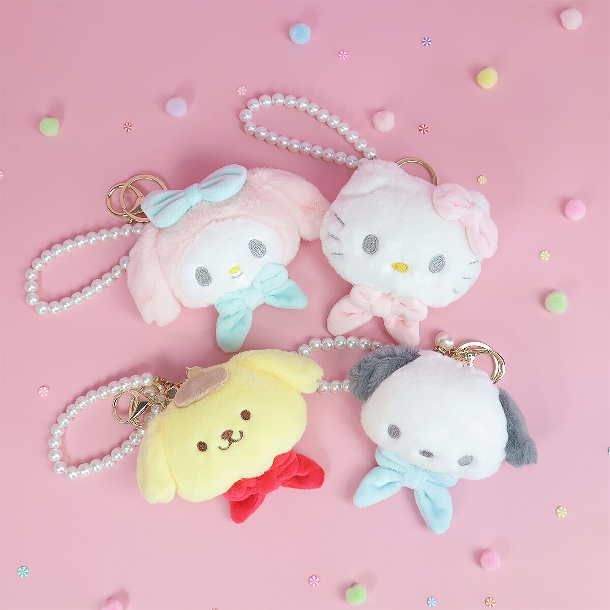 Sanrio plushie-hänge med rosett och pärlor