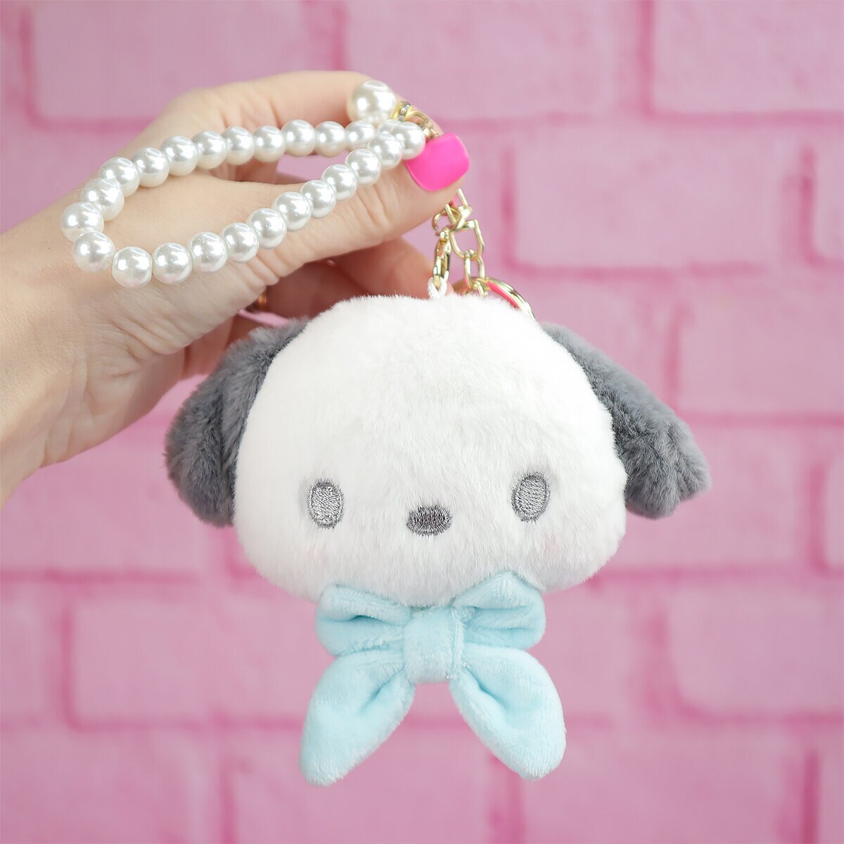 Sanrio plushie-hänge med rosett och pärlor